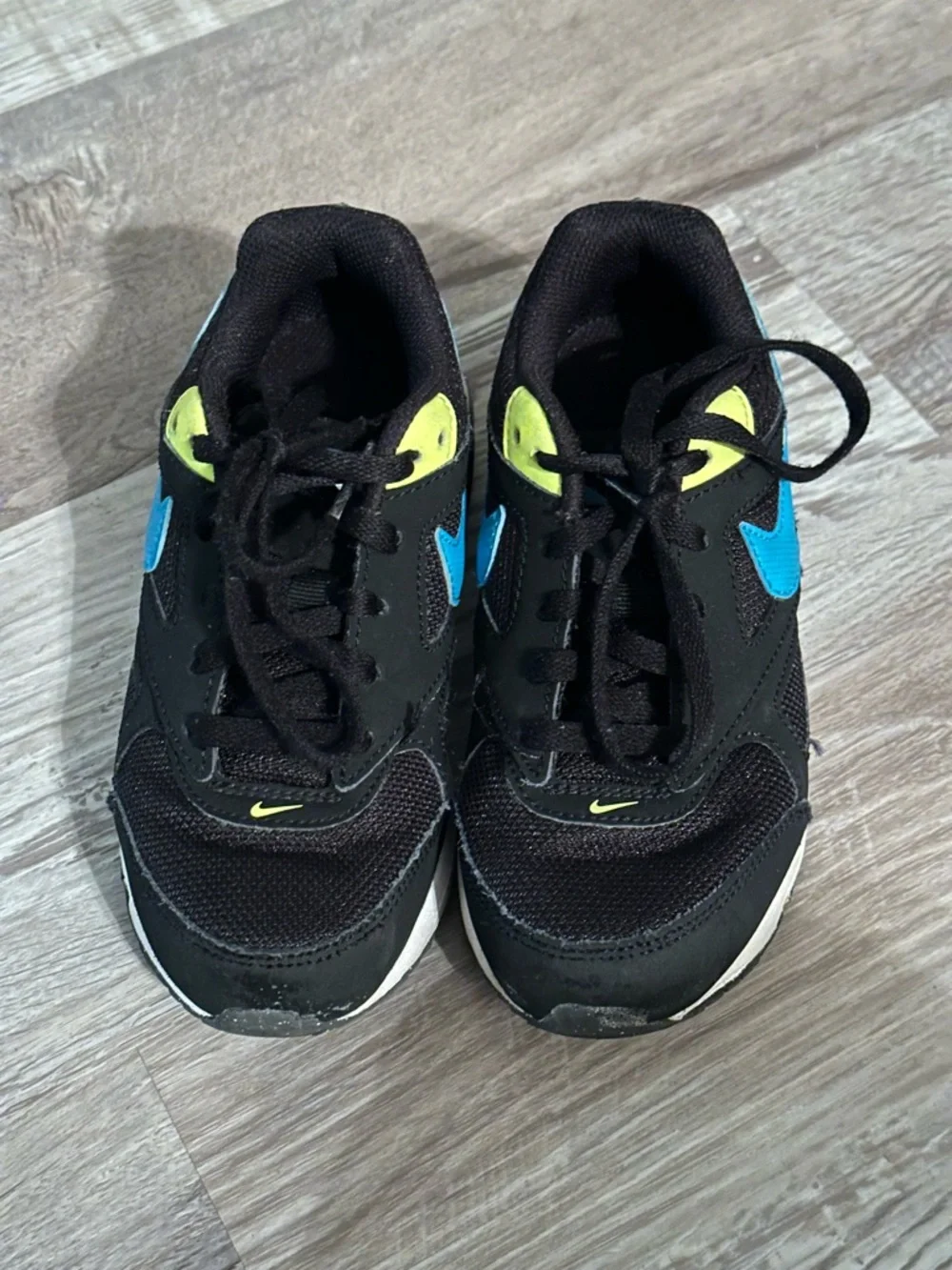 Nike Kids Black Sneakers with Blue Swoosh and Neon Yellow Accents